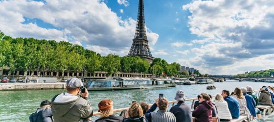 1-Hour River Seine Cruise In Paris Eiffel Tower view while enjoying a leisurely ride on the serene waters of the Seine.