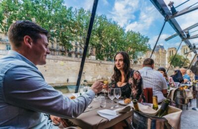 Beautiful evening scene on a River Seine dinner cruise with gourmet food and stunning Parisian skyline in view