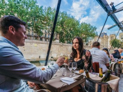 Beautiful evening scene on a River Seine dinner cruise with gourmet food and stunning Parisian skyline in view